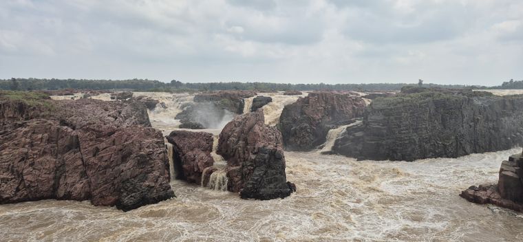 A river in full monsoon flood thundering through a rocky gorge