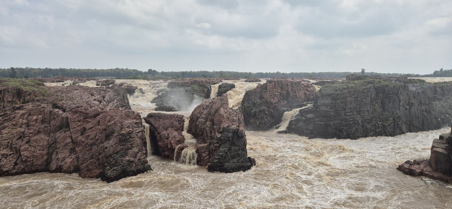 A river in full monsoon flood thundering through a rocky gorge