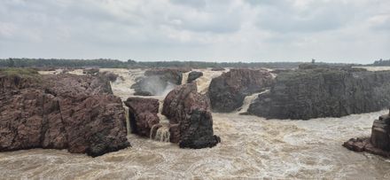 A river in full monsoon flood thundering through a rocky gorge